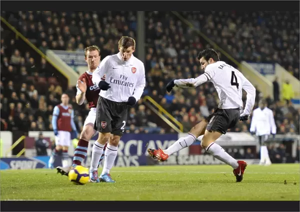 Cesc Fabregas shoots past Burnley goalkeeper Brian Jensen to score the Arsenal goal