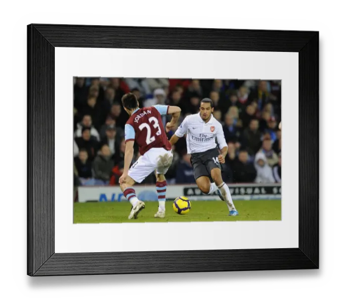 Framed Print : Theo Walcott vs. Stephen Jordan: A Draw at Burnley's Turf Moor in the Barclays Premier League (2009-10)