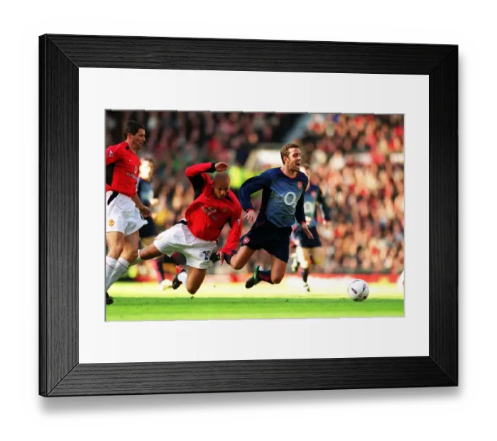 Framed Print : Edu (Arsenal) is folued by Wes Brown (Man Utd)