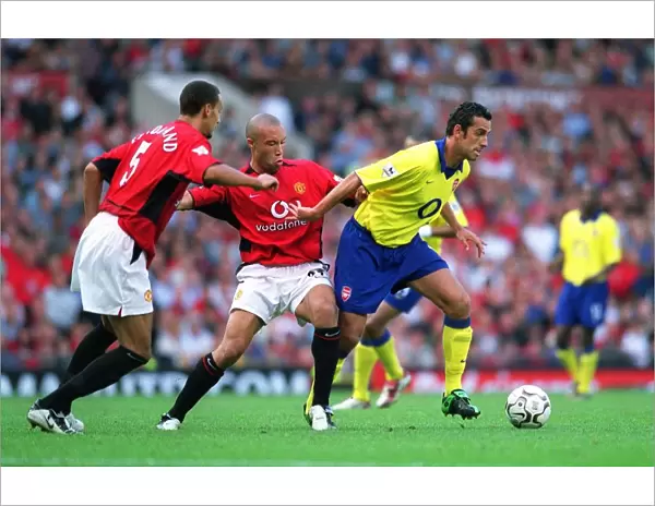 Edu (Arsenal) Mikael Silvestre and Rio Ferdinand (Manchester United)