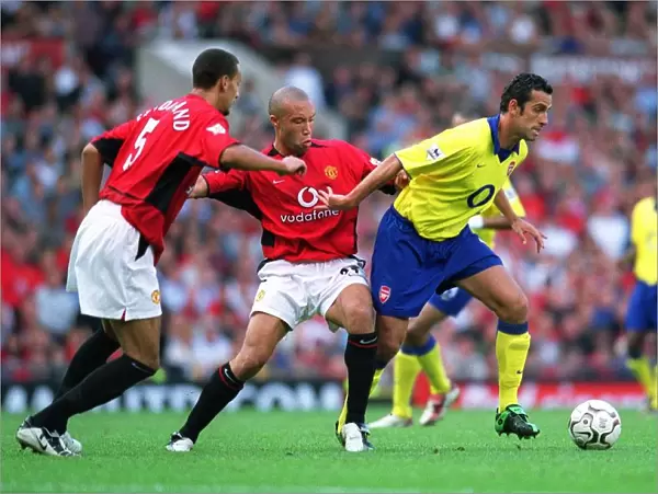 Edu (Arsenal) Mikael Silvestre and Rio Ferdinand (Manchester United)