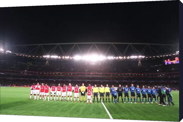 The Arsenal and Hamburg teams line up before the match