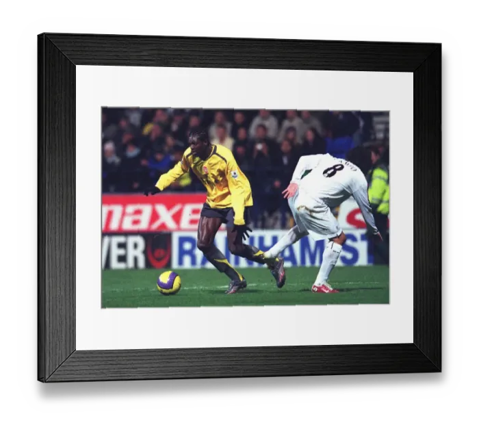 Framed Print : Adebayor vs. Campo: Bolton's Surprise 3-1 Win Over Arsenal in the FA Premiership, 2006 Framed Print : Adebayor vs. Campo: Bolton's Surprise 3-1 Win Over Arsenal in the FA Premiership, 2006