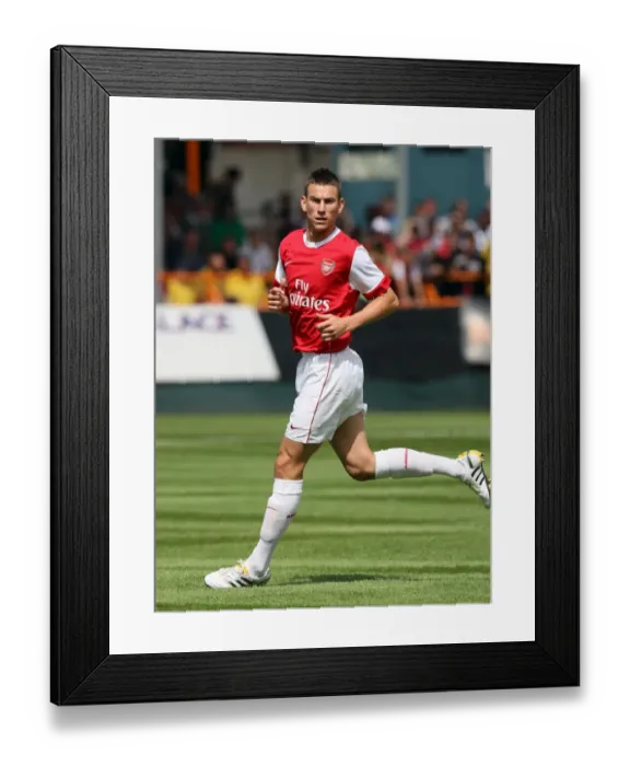 Framed Print : Arsenal's Koscielny Shines in 4-0 Pre-Season Victory over Barnet