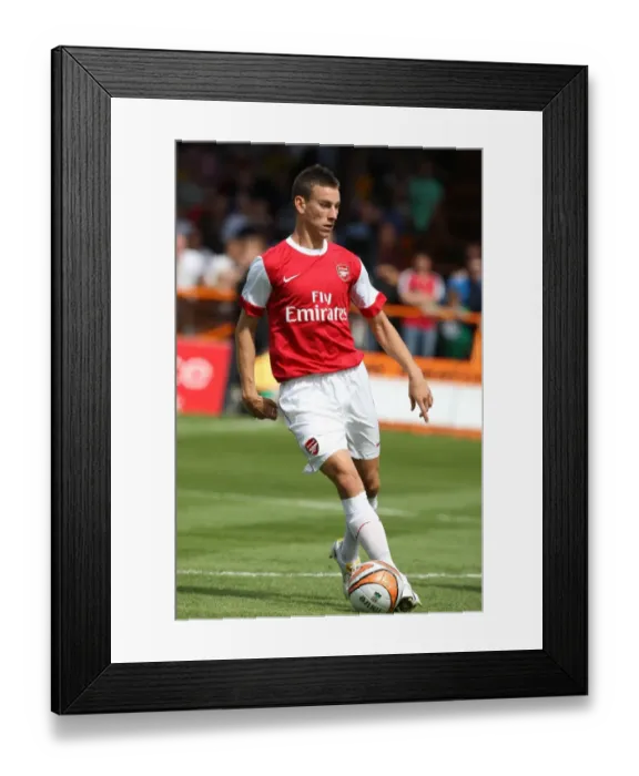 Framed Print : Arsenal's Koscielny Shines in 4-0 Pre-Season Victory over Barnet