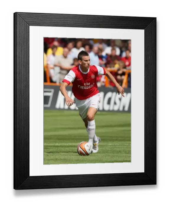 Framed Print : Arsenal's Koscielny Shines in 4-0 Pre-Season Victory over Barnet