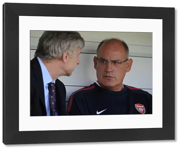 Arsenal 1st team coach Boro Primorac talks with manager Arsene Wenger. Barnet 0: 4 Arsenal