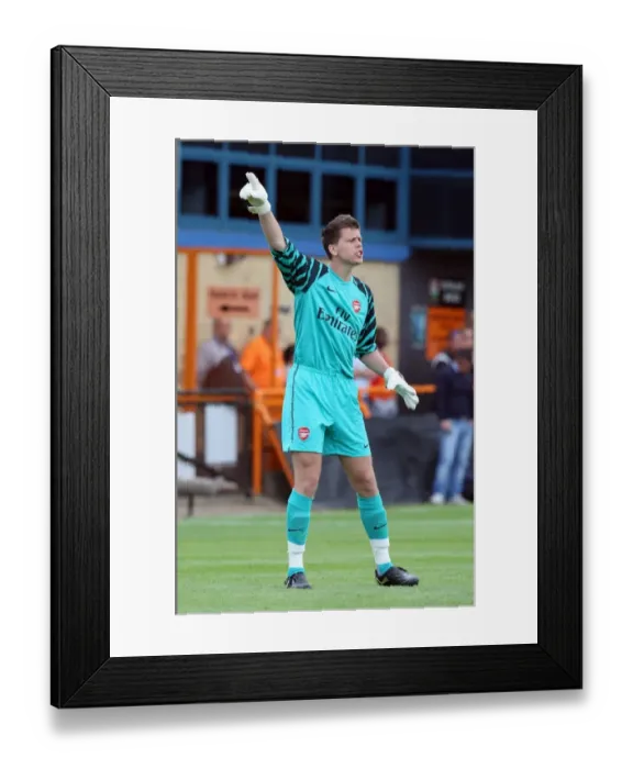 Framed Print : Wojciech Szczesny's Dominant Debut: Arsenal Crushes Barnet 4-0 in Pre-Season Friendly