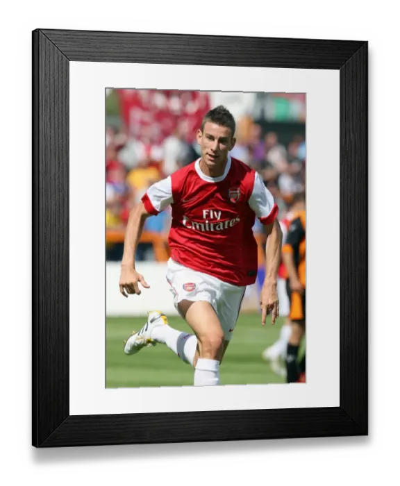 Framed Print : Arsenal's Koscielny Shines in 4-0 Pre-Season Victory over Barnet
