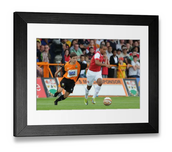Framed Print : Theo Walcott (Arsenal) John McGicks (Barnet). Barnet 0: 4 Arsenal, Pre season friendly Framed Print : Theo Walcott (Arsenal) John McGicks (Barnet). Barnet 0: 4 Arsenal, Pre season friendly