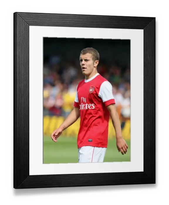 Framed Print : Jack Wilshere's Brilliant Performance: Arsenal Crushes Barnet 4-0 in Pre-Season Friendly