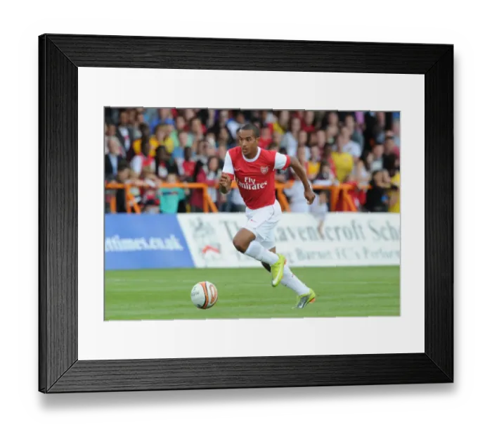 Framed Print : Theo Walcott's Star Performance: Arsenal Dominates Barnet 4-0 in Pre-Season Friendly