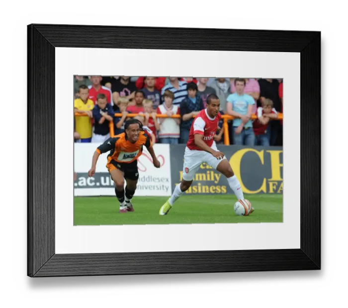 Framed Print : Theo Walcott (Arsenal) Sam Cox (Barnet). Barnet 0: 4 Arsenal, Pre season friendly Framed Print : Theo Walcott (Arsenal) Sam Cox (Barnet). Barnet 0: 4 Arsenal, Pre season friendly