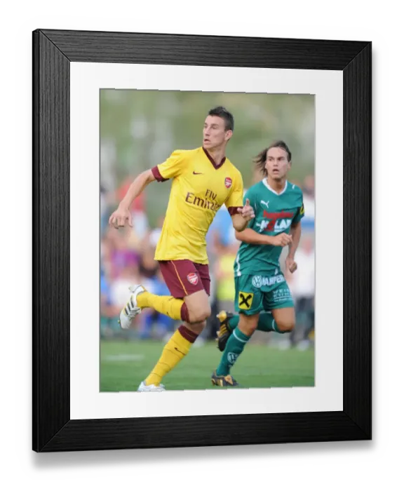 Framed Print : Koscielny's Dominance: Arsenal's 4-0 Win Over SC Neusiedl Framed Print : Koscielny's Dominance: Arsenal's 4-0 Win Over SC Neusiedl
