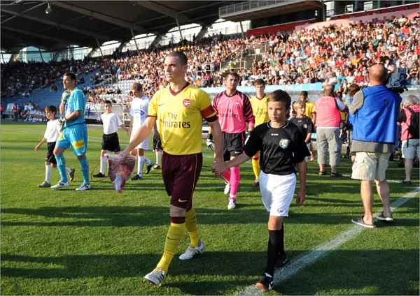 Arsenal captain Thomas Vermaelen leads the team out before the match. Sturm Graz 0