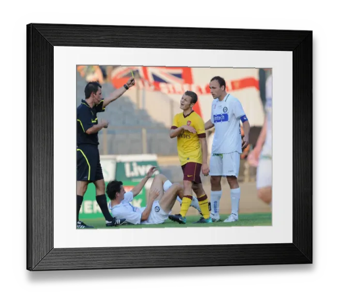 Framed Print : Jack Wilshere (Arsenal) is shown the yellow card by referee Alexander Harkamp Framed Print : Jack Wilshere (Arsenal) is shown the yellow card by referee Alexander Harkamp