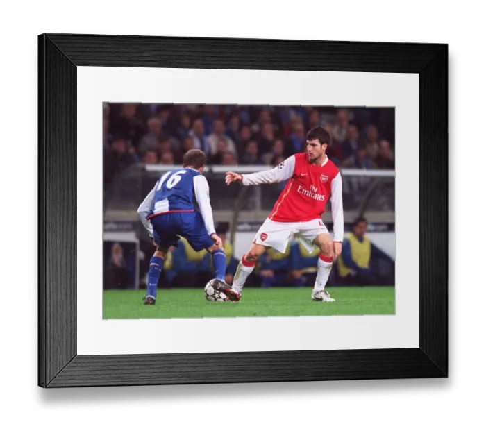 Framed Print : Cesc Fabregas (Arsenal) Raul Meireles (Porto) Framed Print : Cesc Fabregas (Arsenal) Raul Meireles (Porto)