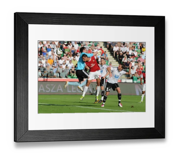 Framed Print : Marouane Chamakh heads past Leiga goalkeeper Marijan Antolovic to score the 1st Arsenal goal