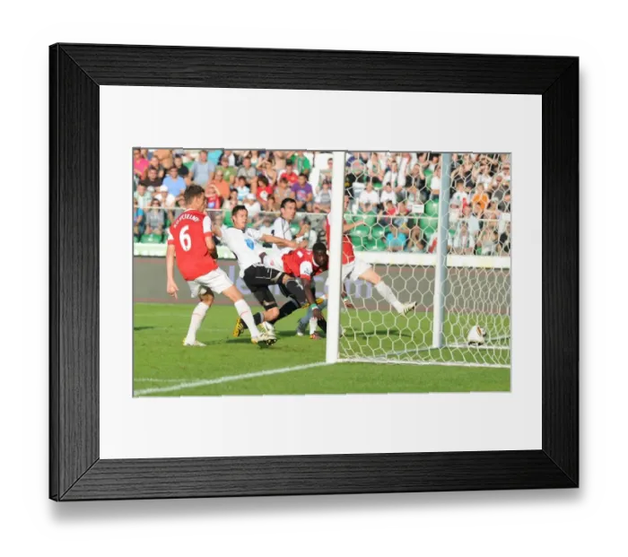 Framed Print : Emmanuel Eboue heads past Ariel Borysiuk to score the 2nd Arsenal goal