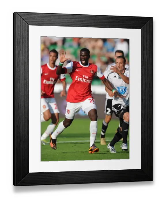 Framed Print : Emmanuel Eboue vs. Srda Knezevic: Arsenal's Triumph over Legia Warsaw (5-6) Framed Print : Emmanuel Eboue vs. Srda Knezevic: Arsenal's Triumph over Legia Warsaw (5-6)