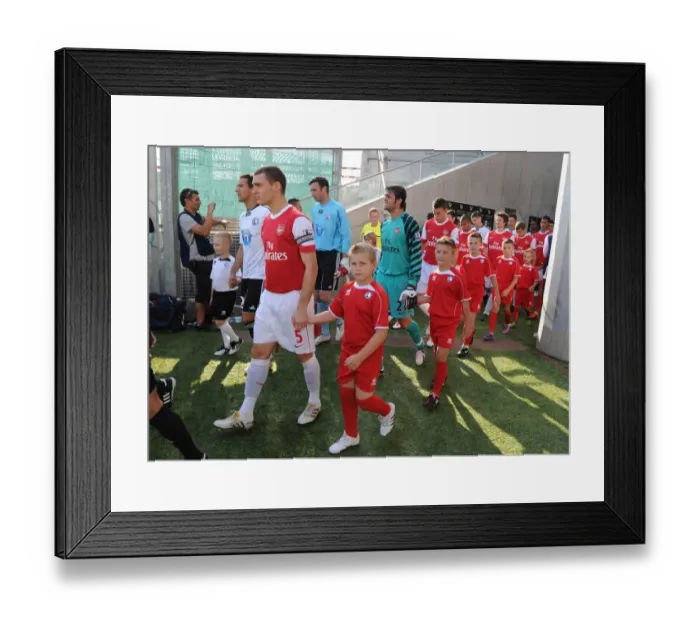 Framed Print : Arsenal captain Thomas Vermaelen leads out the team before the match. Legia Warsaw 5