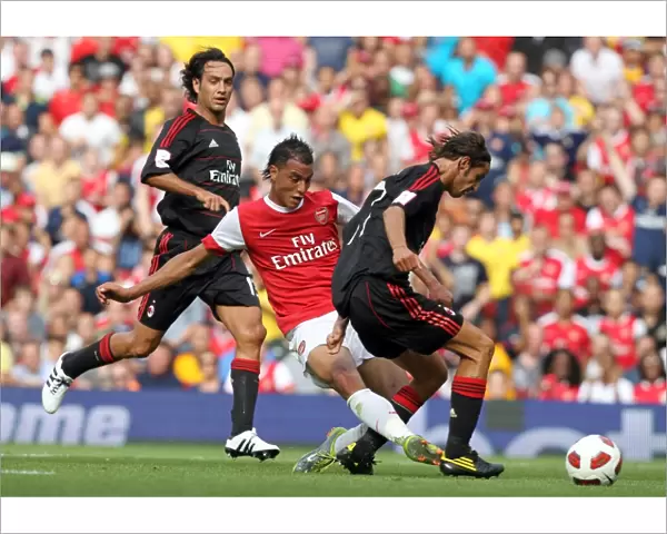 Marouane Chamakh scores Arsenals goal past Luca Antonini (Milan). Arsenal 1