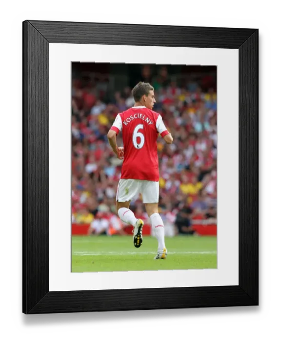 Framed Print : Arsenal's Laurent Koscielny Faces Off Against AC Milan at the Emirates Cup, 2010