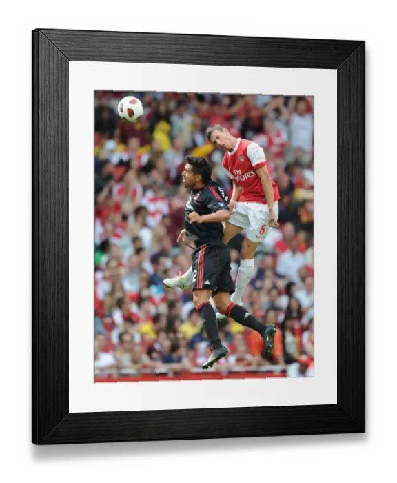 Framed Print : Laurent Koscielny (Arsenal) Borriello (Milan). Arsenal 1: 1 AC Milan. Emirates Cup Framed Print : Laurent Koscielny (Arsenal) Borriello (Milan). Arsenal 1: 1 AC Milan. Emirates Cup
