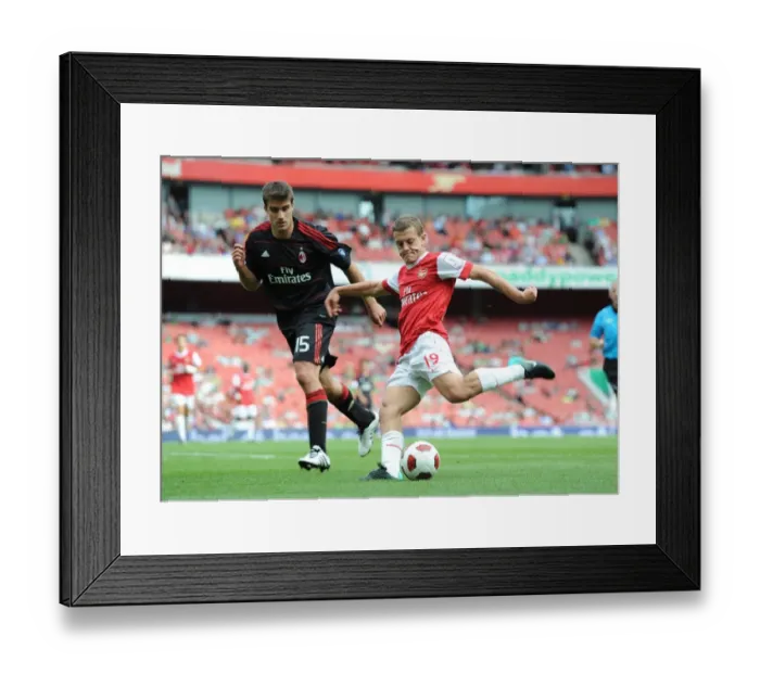 Framed Print : Arsenal's Jack Wilshere vs AC Milan's Sokratis Papastathopoulos - Emirates Cup Showdown