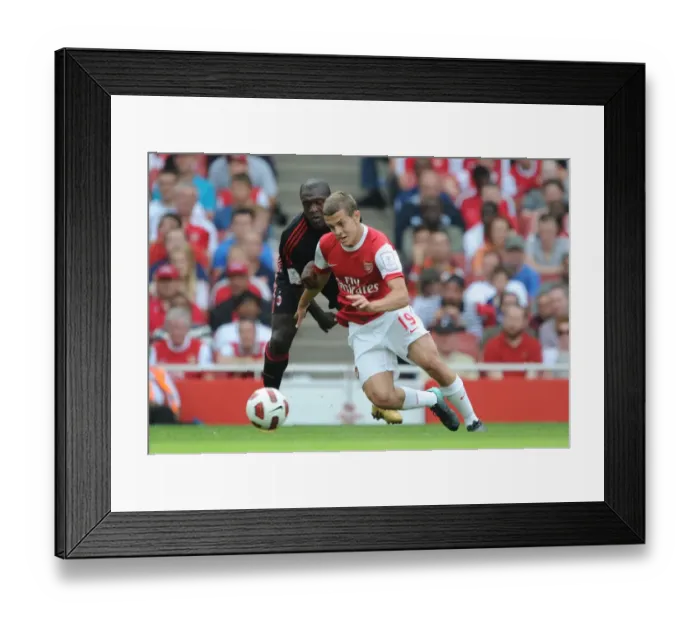 Framed Print : Clash of Midfield Maestros: Jack Wilshere (Arsenal) vs. Clarence Seedorf (AC Milan) - Emirates Cup, 2010