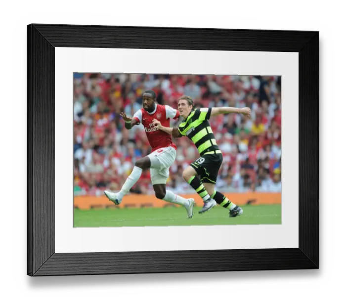 Framed Print : Johan Djourou (Arsenal) Morten Rasmussen (Celtic). Arsenal 3: 2 Celtic. Emirates Cup