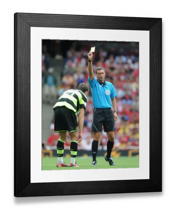 Framed Print : Referee Andre marriner shows a yellow card to Charlie Mulgrew (Celtic) Framed Print : Referee Andre marriner shows a yellow card to Charlie Mulgrew (Celtic)