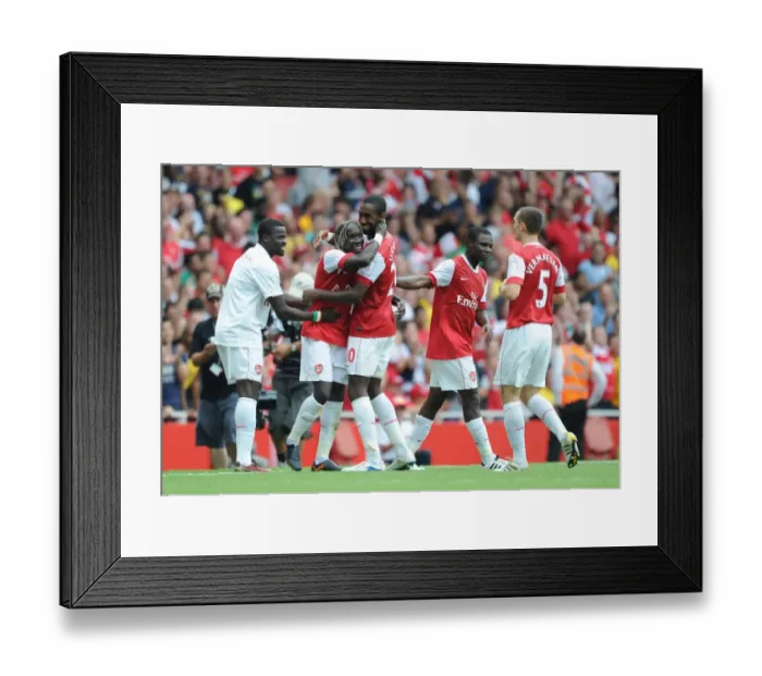 Framed Print : Sagna, Djourou, and Eboue: Arsenal's Unforgettable Celebration of a Pre-Season Double Strike Against Celtic