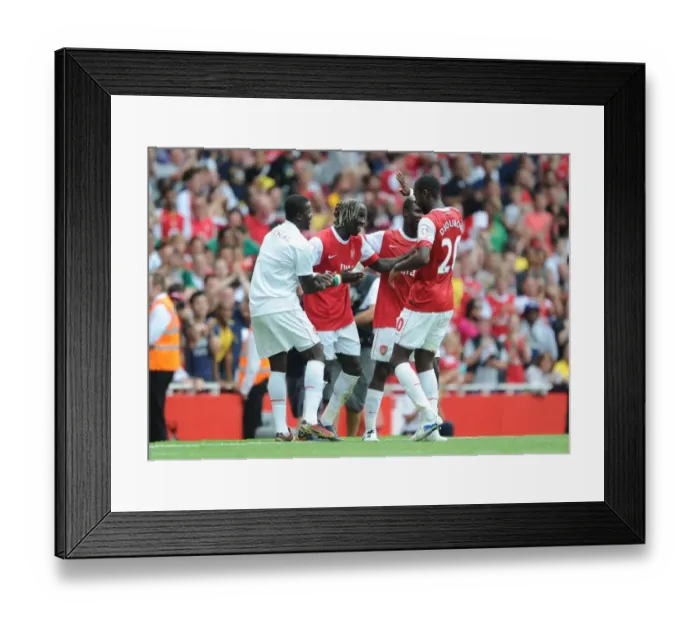 Framed Print : Sagna, Eboue, and Djourou: Arsenal's Unforgettable Celebration of a Pre-Season Double Strike Against Celtic (2010)