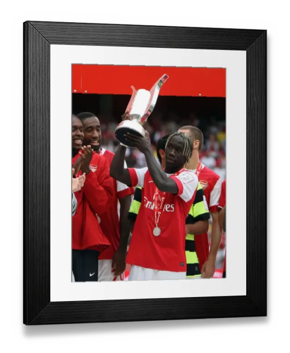 Framed Print : Bacary Sagna (Arsenal) lifts the Emirates Trophy. Arsenal 3: 2 Celtic. Emirates Cup Pre Season Framed Print : Bacary Sagna (Arsenal) lifts the Emirates Trophy. Arsenal 3: 2 Celtic. Emirates Cup Pre Season