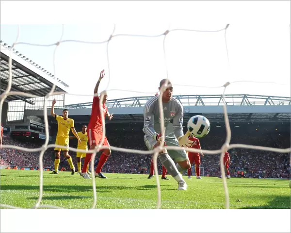 Liverpool goalkeeper Pepe Reina pushes the ball into his own net to score the Arsenal goal