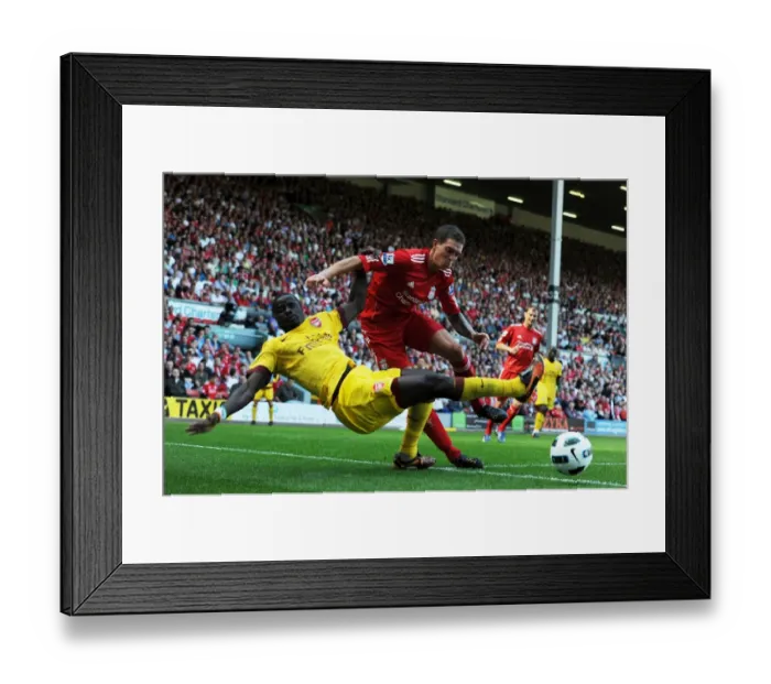 Framed Print : Head-to-Head: Eboue vs. Agger in the Intense Liverpool vs. Arsenal Rivalry Framed Print : Head-to-Head: Eboue vs. Agger in the Intense Liverpool vs. Arsenal Rivalry