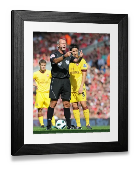 Framed Print : Samir Nasri (Arsenal) and referee Martin Atkinson. Liverpool 1: 1 Arsenal