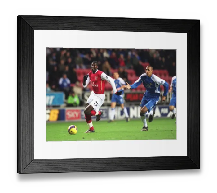 Framed Print : Emmauel Adebayor (Arsenal) Emmerson Boyce (Wigan) Framed Print : Emmauel Adebayor (Arsenal) Emmerson Boyce (Wigan)