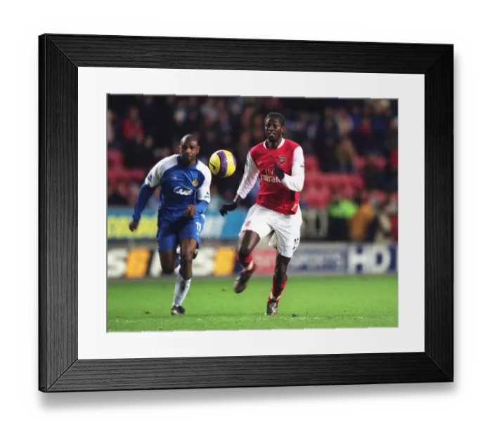 Framed Print : Emmanuel Adebayor breaks through to score Arsenals goal Framed Print : Emmanuel Adebayor breaks through to score Arsenals goal