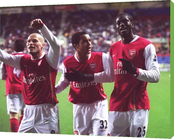 Emmanuel Adebayor celebrates scoring Arsenals goal with Theo Walcott