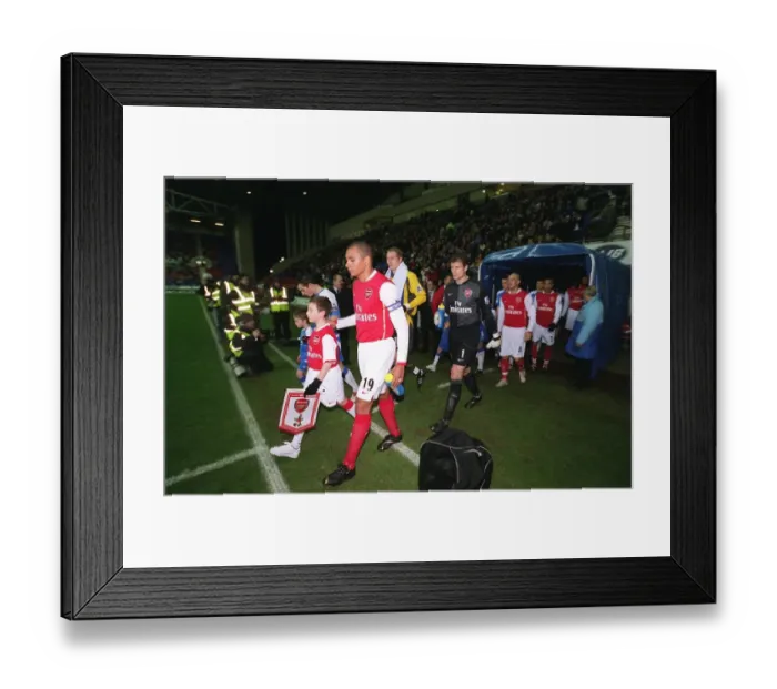 Framed Print : Gilberto (Arsenal) leads the team out before the match