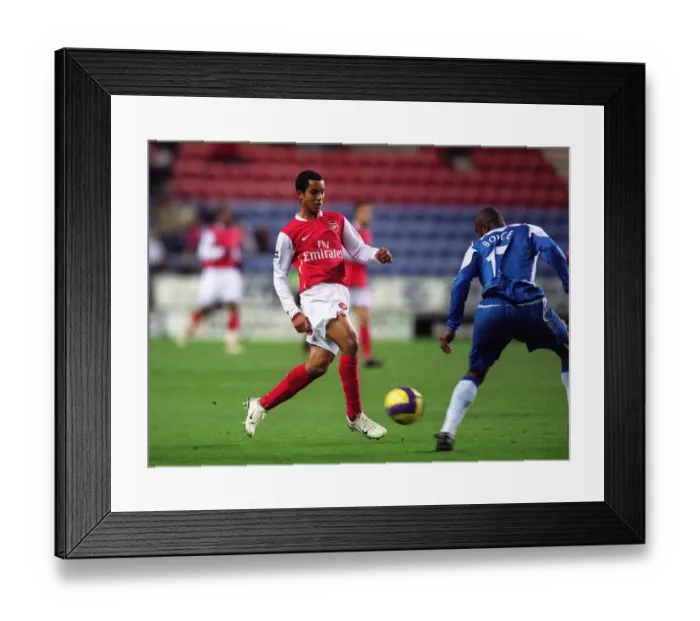 Framed Print : Theo Walcott (Arsenal) Emmerson Boyce (Wigan) Framed Print : Theo Walcott (Arsenal) Emmerson Boyce (Wigan)