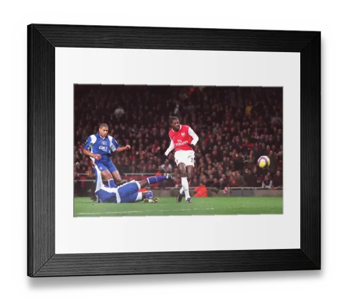 Framed Print : Emmauel Adebayor scores Arsenals 1st goal under pressure from Linvoy Primus Framed Print : Emmauel Adebayor scores Arsenals 1st goal under pressure from Linvoy Primus