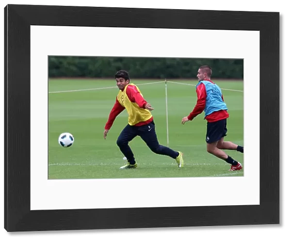 Eduardo and Herni Lansbury (Arsenal). Arsenal Training Session. Arsenal Training Ground