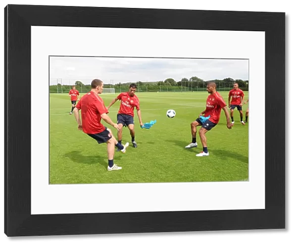 Thomas Vermaelen Marouane Chamakh and Armand Traore (Arsenal). Arsenal Training Ground