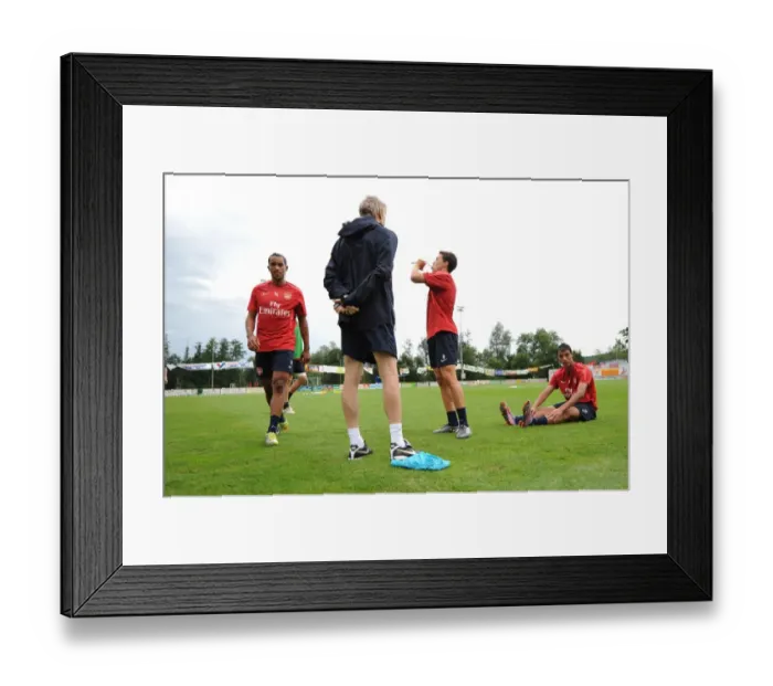 Framed Print : Arsenal manager Arsene Wenger with Theo Walcott and Samir Nasri. Arsenal Training Camp Framed Print : Arsenal manager Arsene Wenger with Theo Walcott and Samir Nasri. Arsenal Training Camp