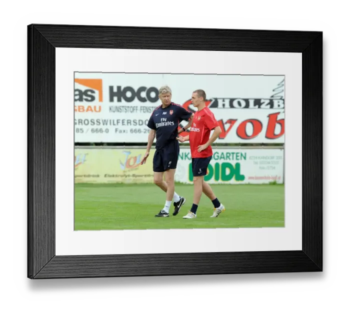 Framed Print : Arsenal manager Arsene Wenger with Thomas Vermaelen. Arsenal Training Camp Framed Print : Arsenal manager Arsene Wenger with Thomas Vermaelen. Arsenal Training Camp