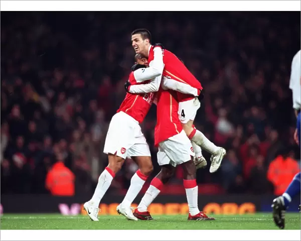Cesc Fabregas celebrates setting up the 6th Arsenal goal with Julio Baptista