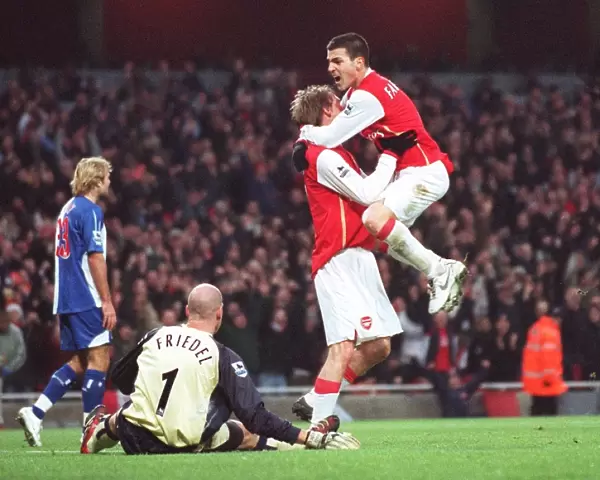 Alex Hleb celebrates scoring Arsenals 2nd goal with Cesc Fabregas and Brad Friedel